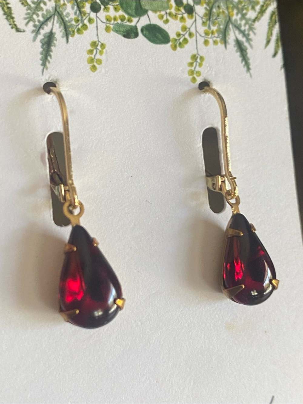 Gold-Tone Teardrop Earrings with Deep Red Crystal Drops